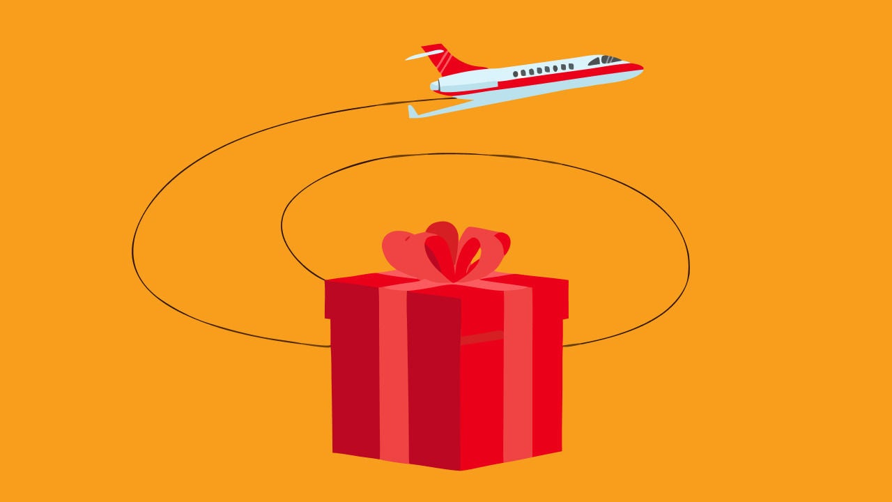 airplane leaving vapor trail above gift