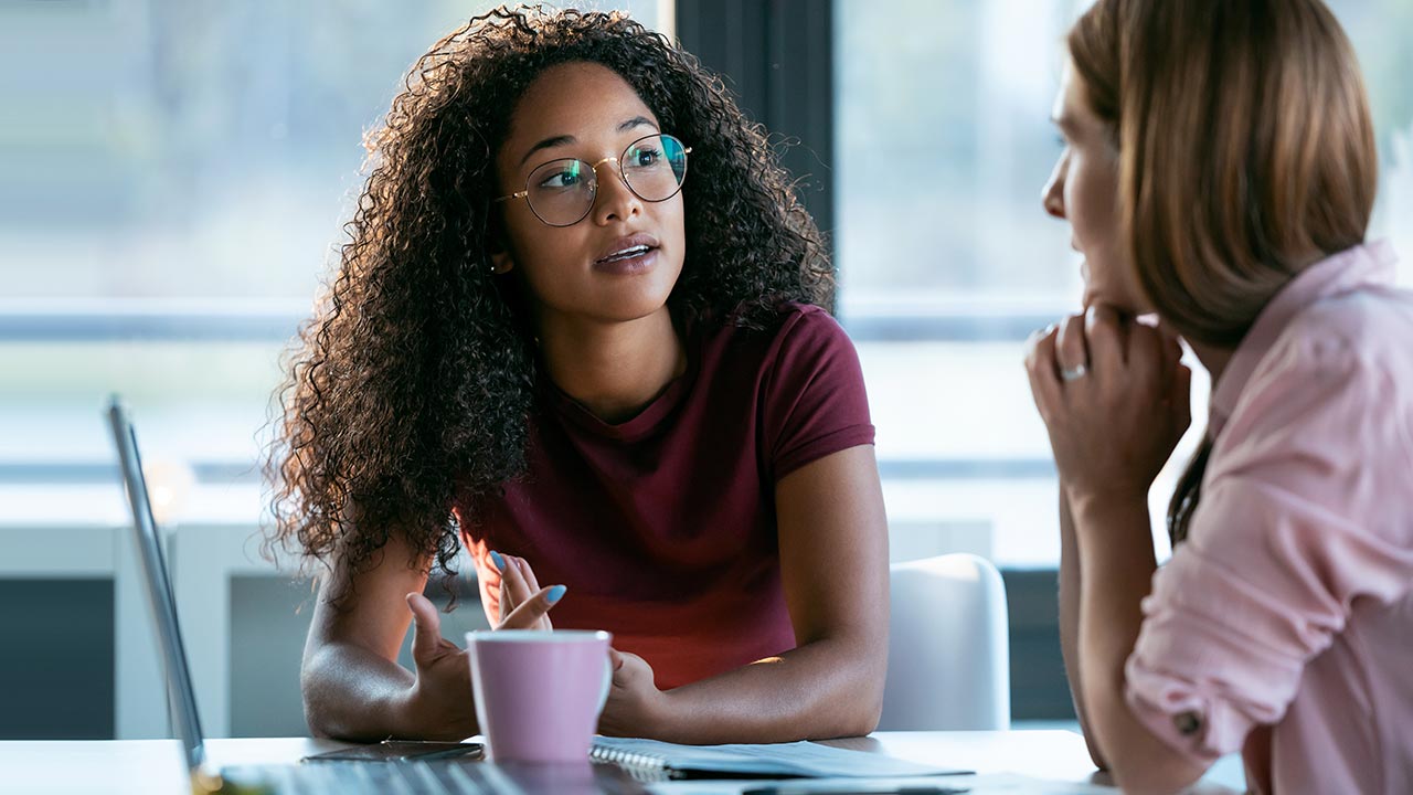 Business women working together in an office.