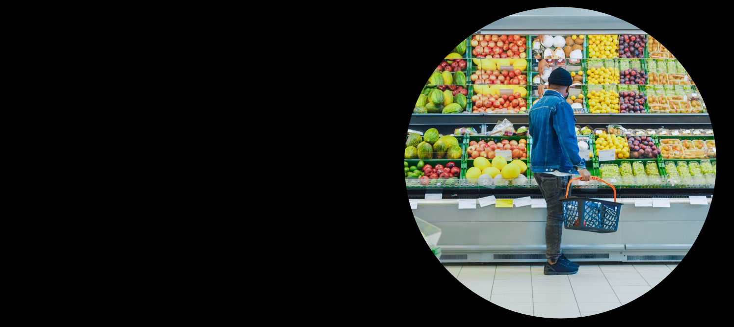 Man at grocery store looking at fruit