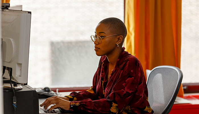 Two women coworkers brainstorming