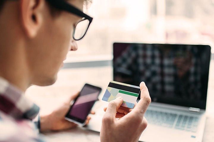 Man paying online with card