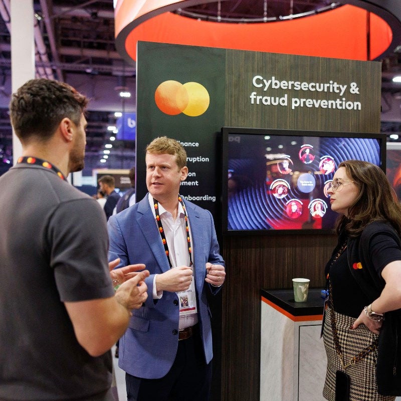 Attendees and presenters at Money 2020 talk at the Mastercard booth. 