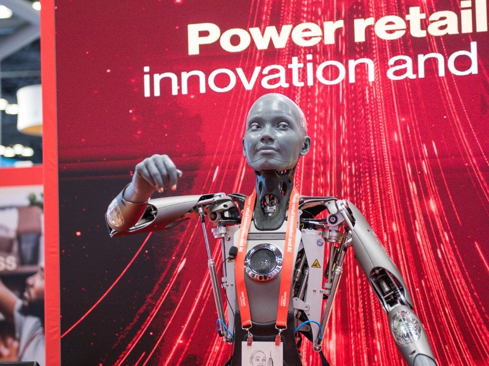 Tony Lutz of Verizon stands in front of a photo booth. 