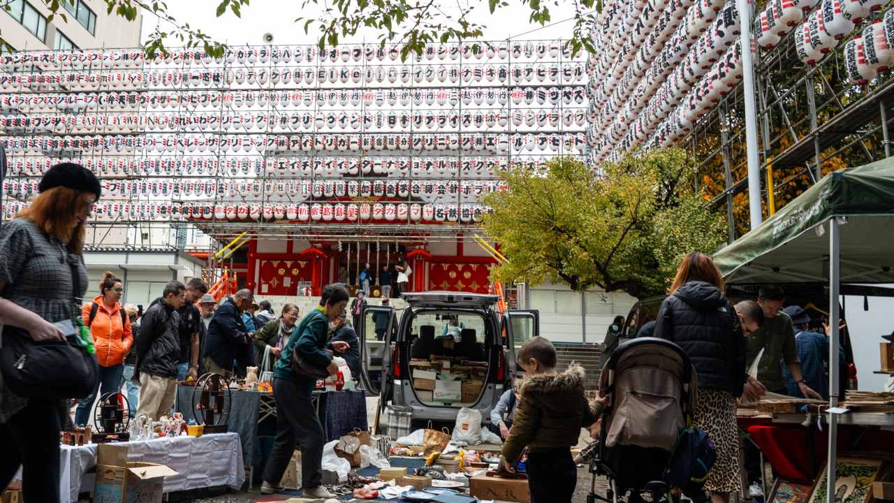 People shop at a flea market in Japan. 
