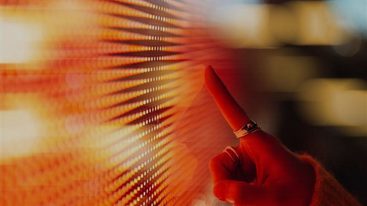  A person holding a cell phone in their hand