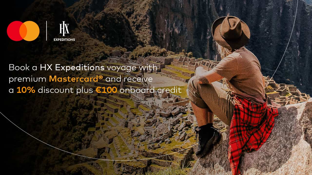 woman sitting overlooking machu picchu