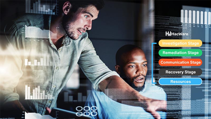 Two men looking at computer data.