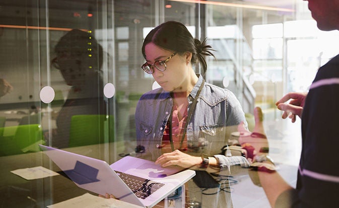 Woman technician using a laptop