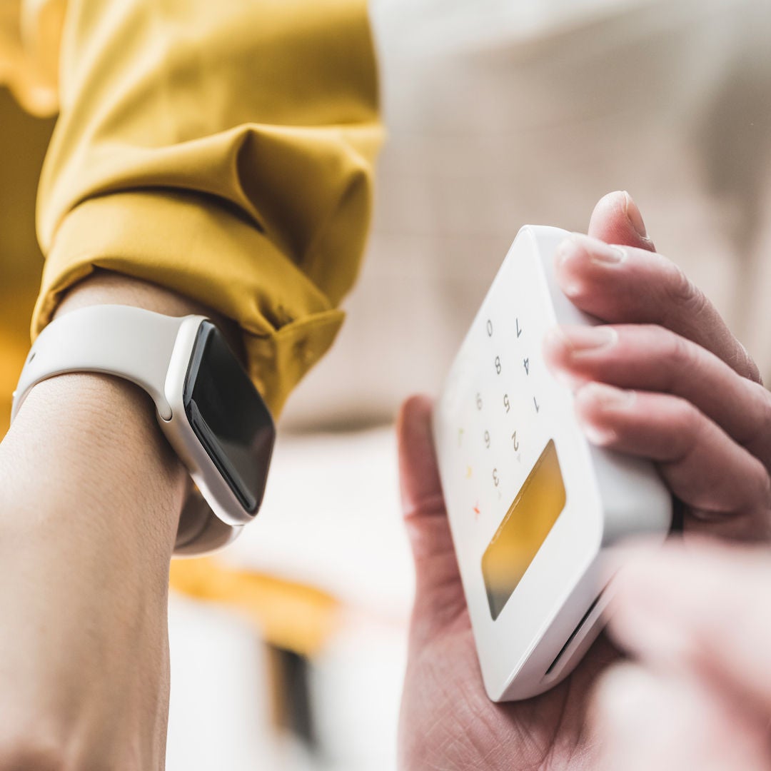 Person making a payment with a watch.
