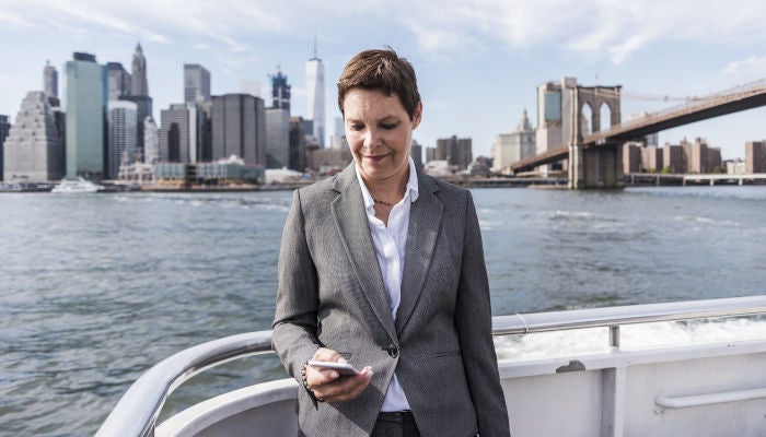 Businesswoman using cell phone