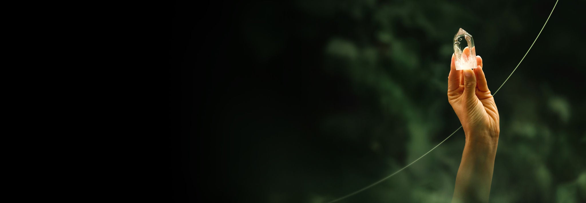 Hand holding a crystal