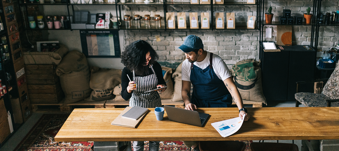 Couple reviewing their shop sales