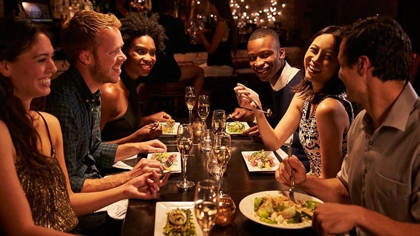 Group of friends dining in a restaurant.