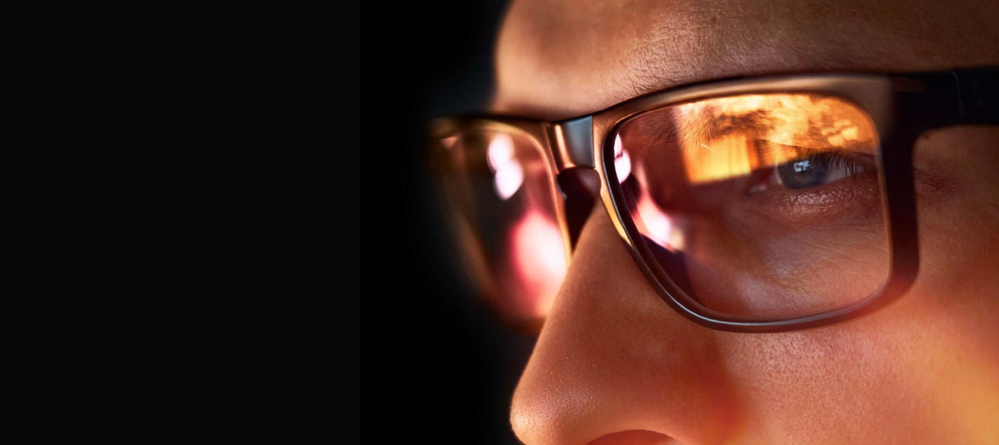 Reflection of a screen in someones glasses