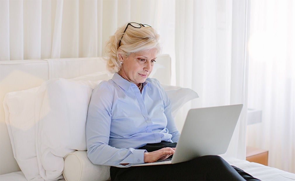Mature business woman using a laptop