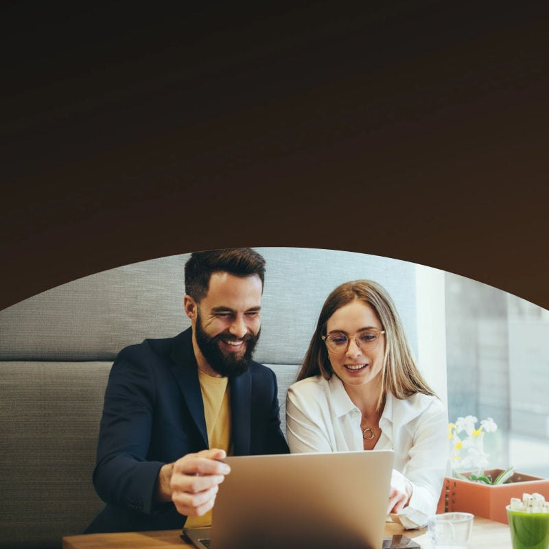 office man and woman looking laptop