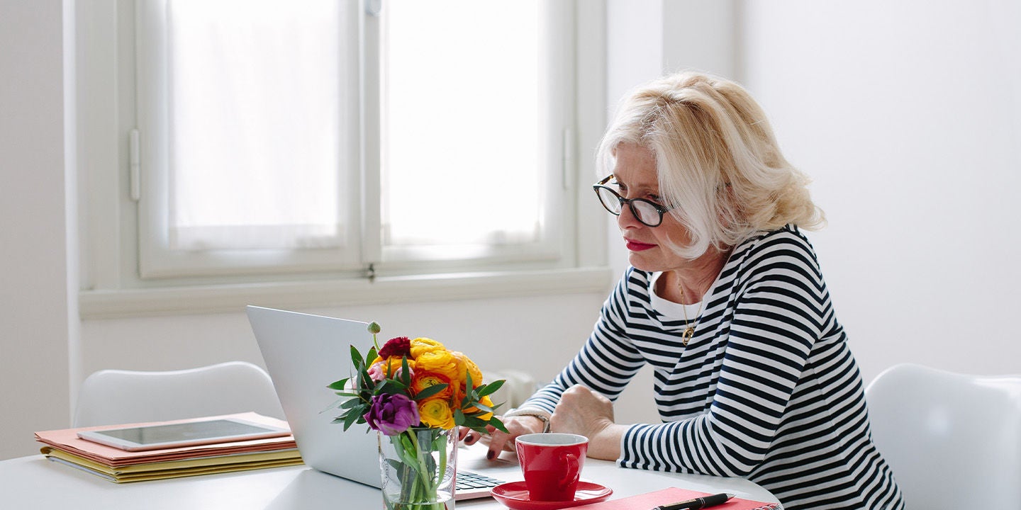 Woman using her computer at home