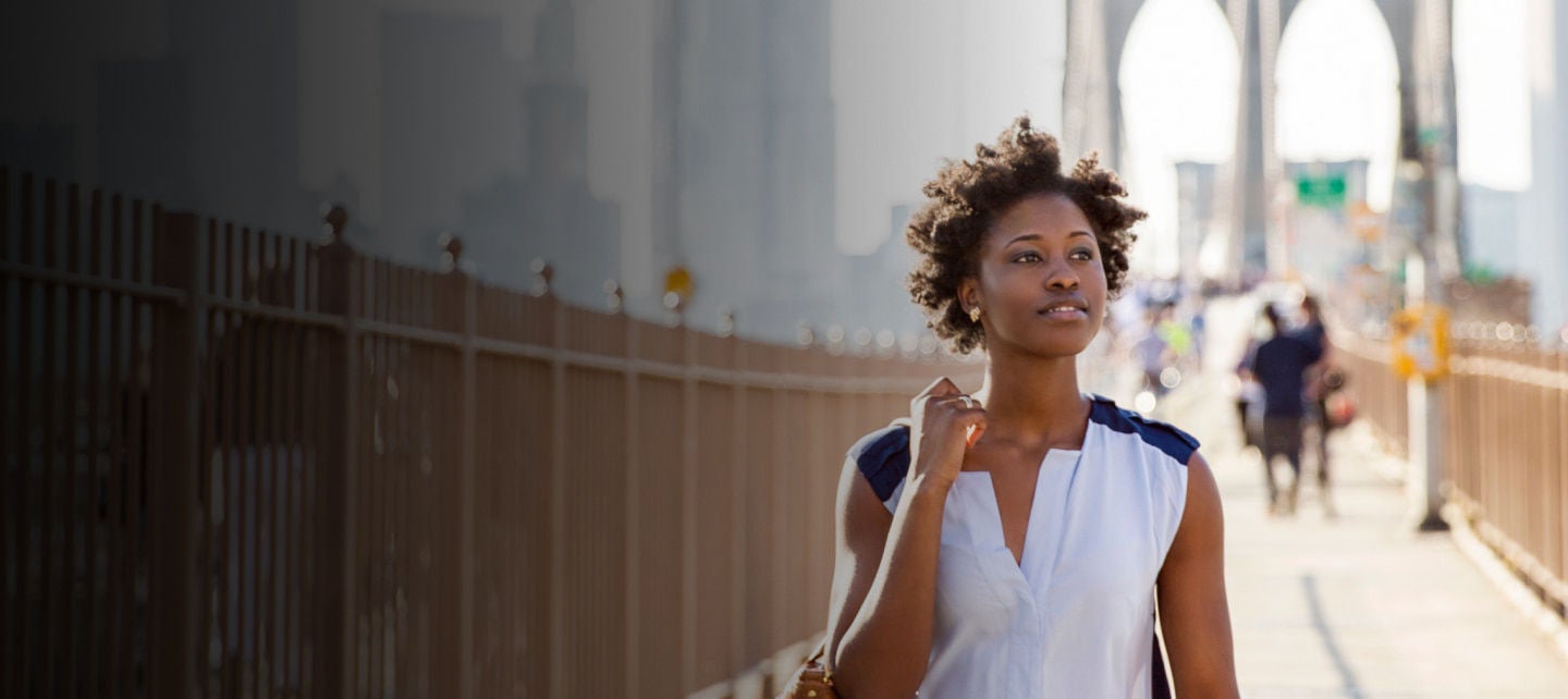 woman walking on a bridge