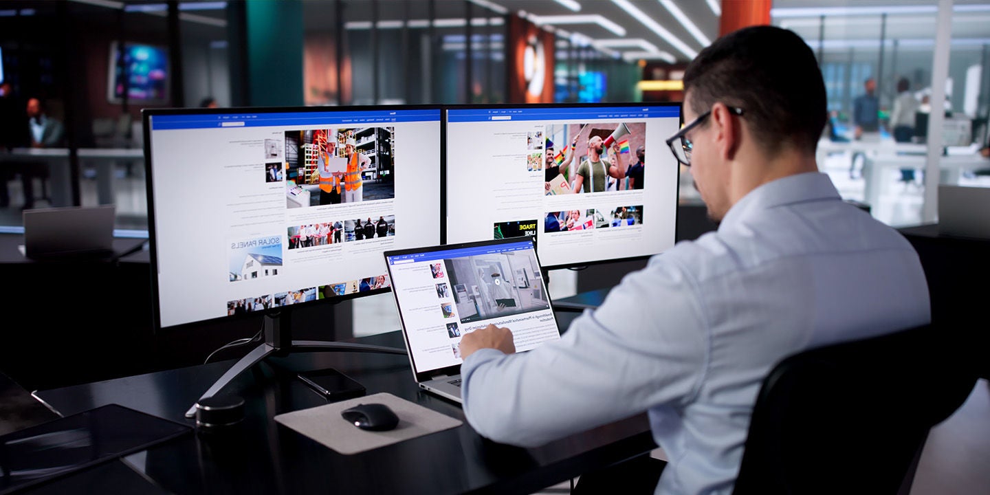A man reading the news on his computer