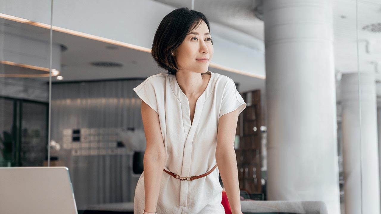 Content looking woman in charge.