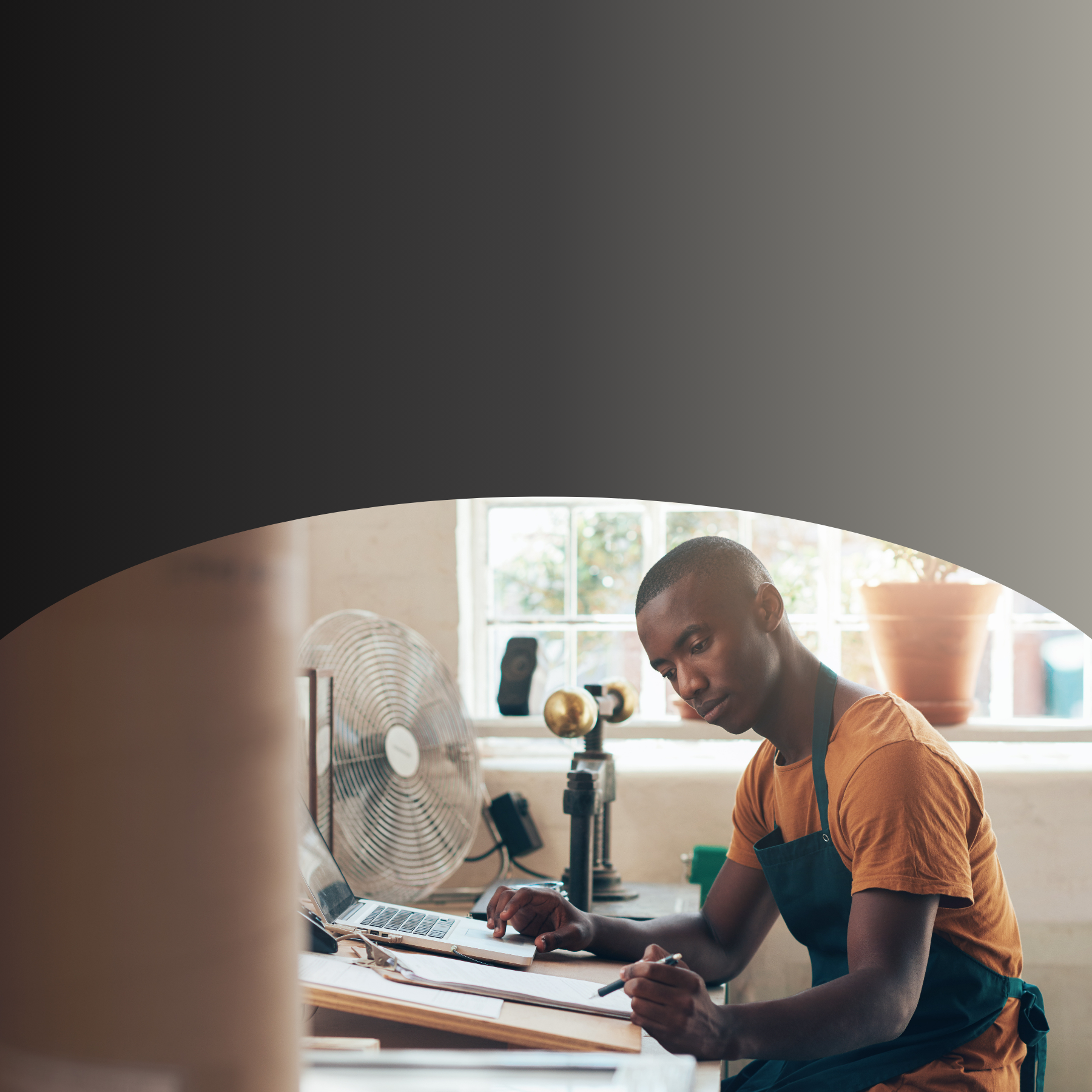 person sitting at desk workimng
