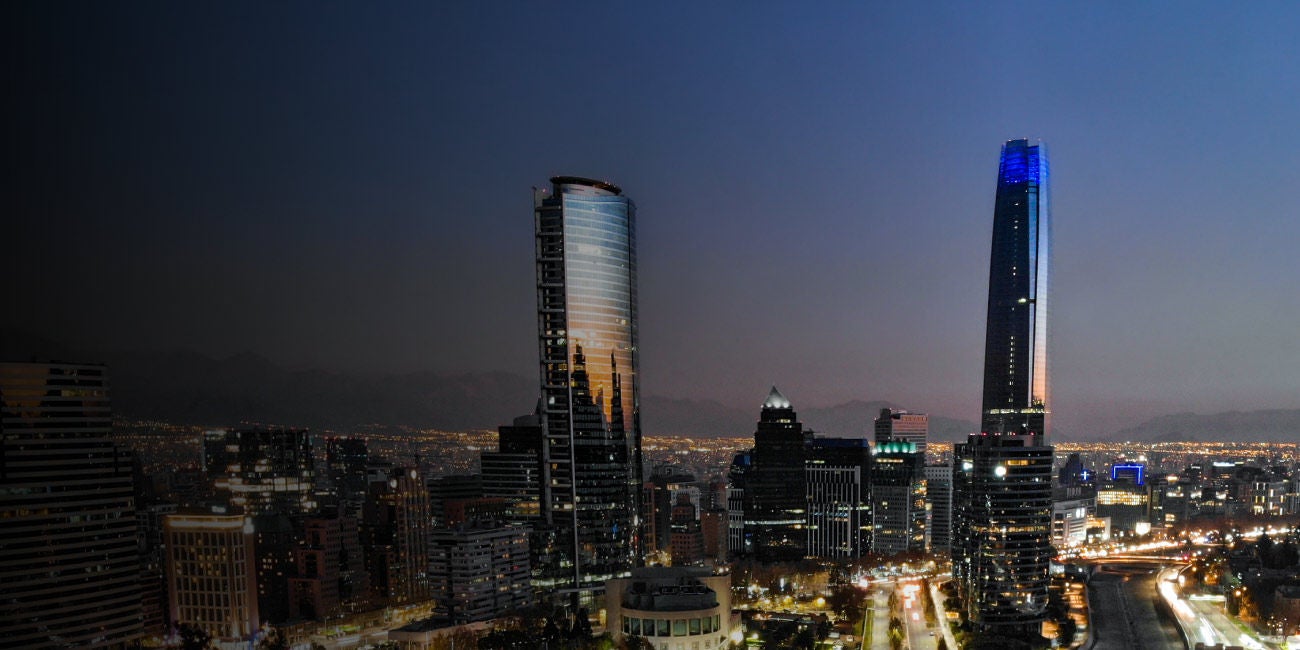 Two smiling people enjoying the benefits of being a Mastercard cardholder.