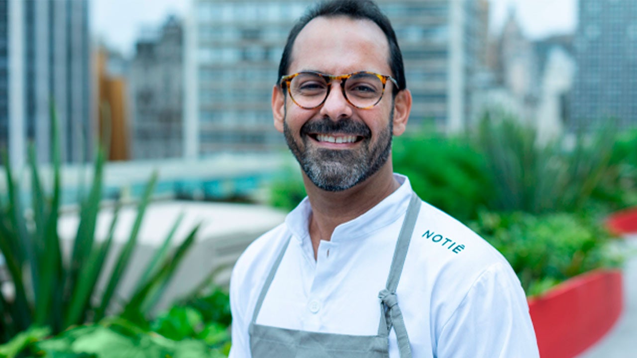 Father and son checking a tablet.