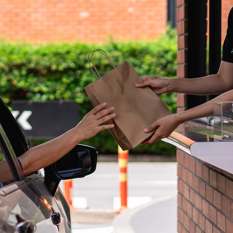 Someone getting their drive thru order