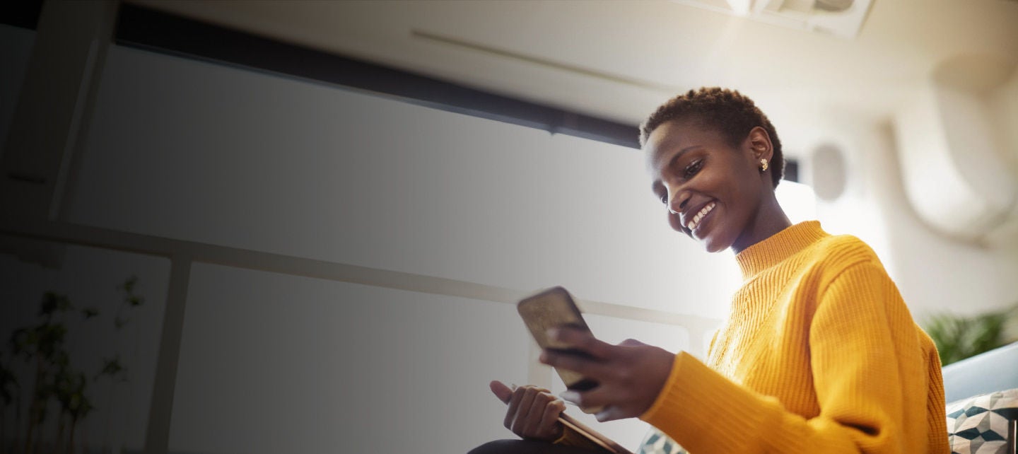 woman with a phone and a tablet
