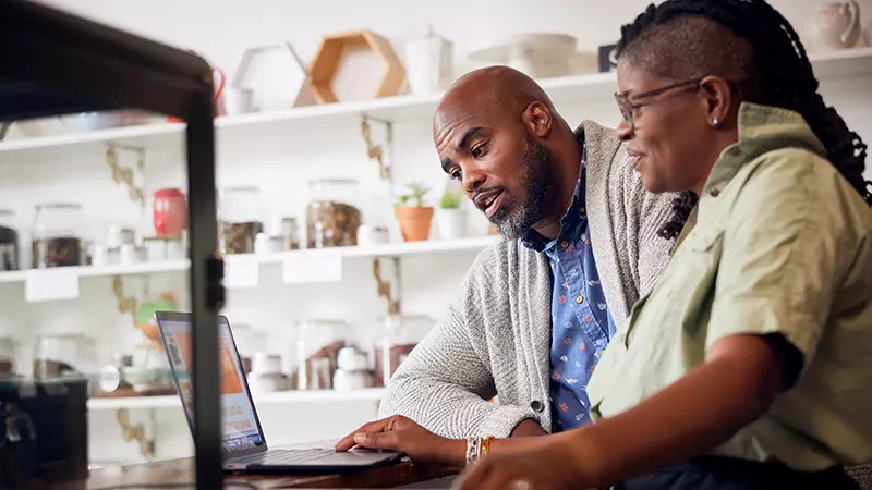 Man and woman looking at tablet