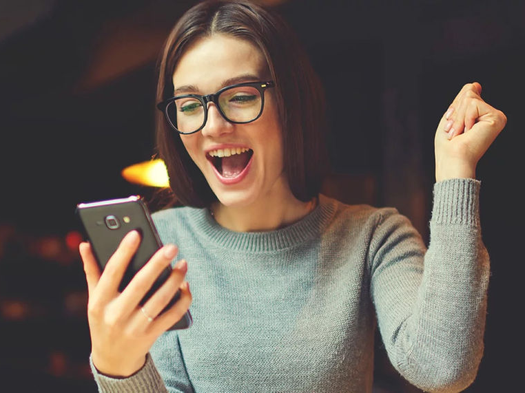 Woman cheering about her credit score