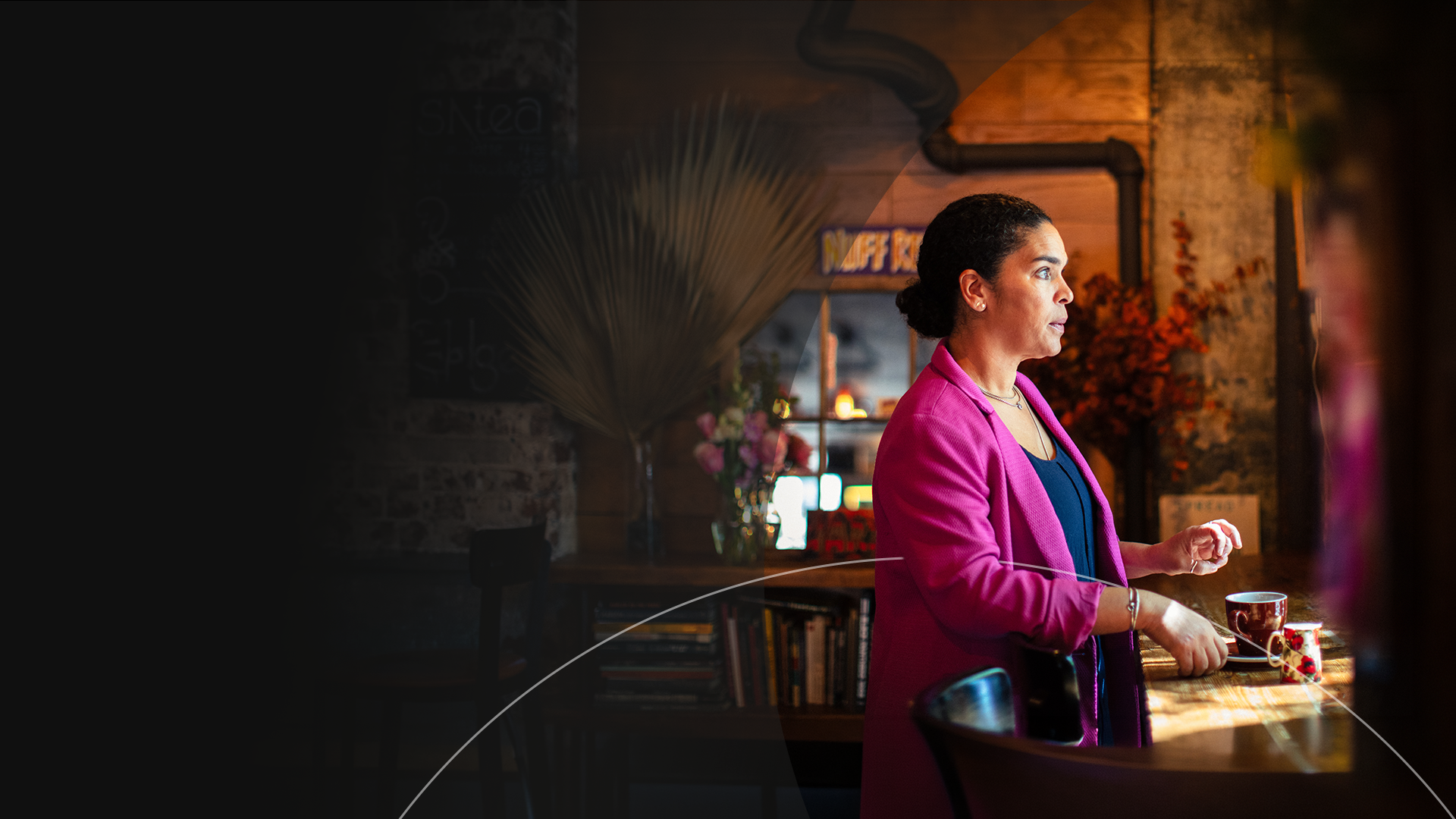 woman with cup of coffee in a public place