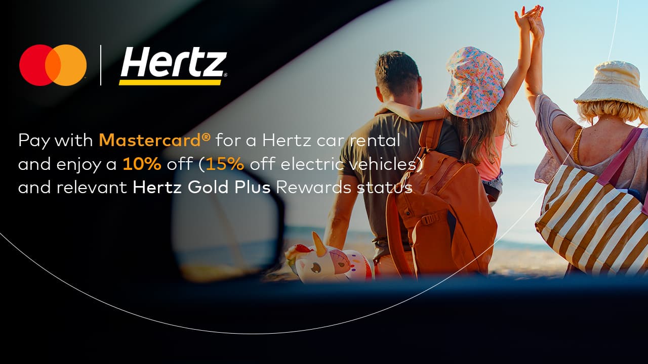 family walking toward sunny beach