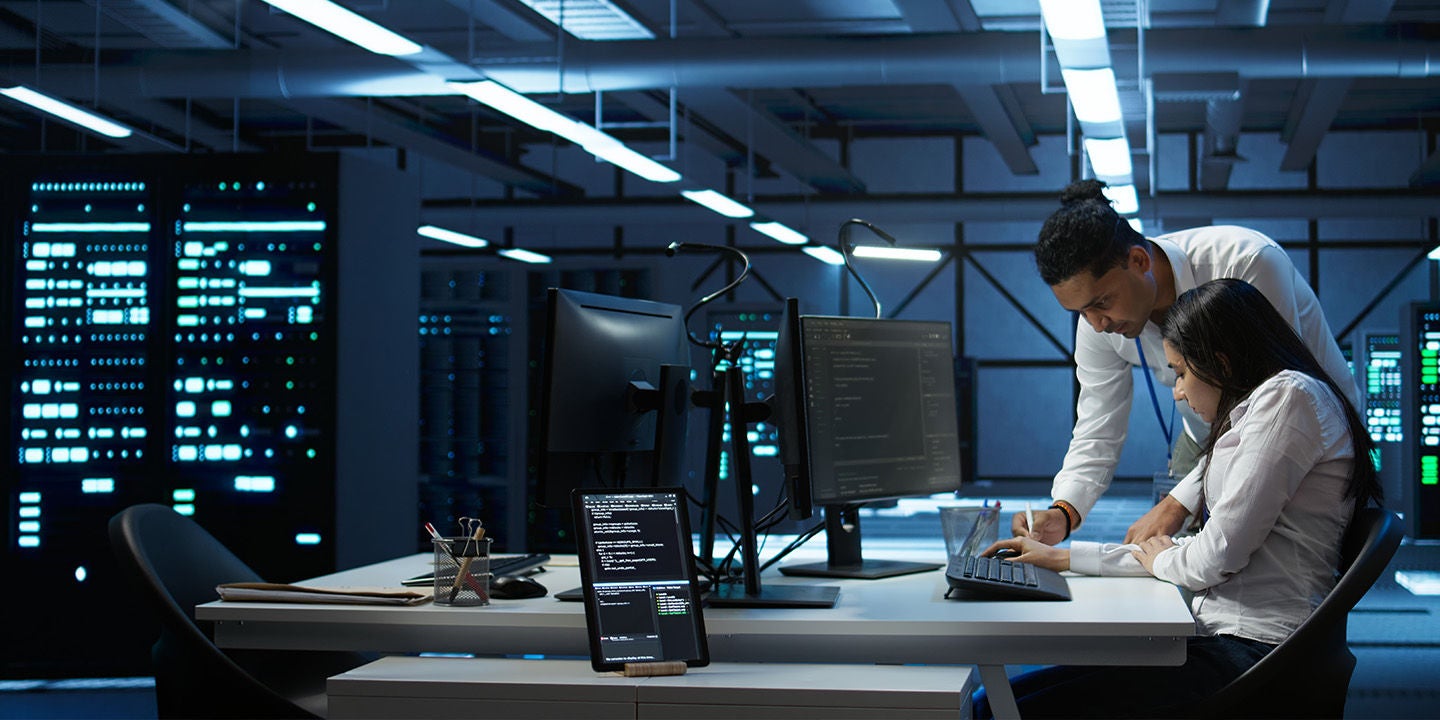 Cybersecurity experts working on their computer