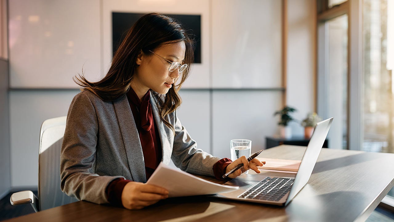 Businesswoman working in office.