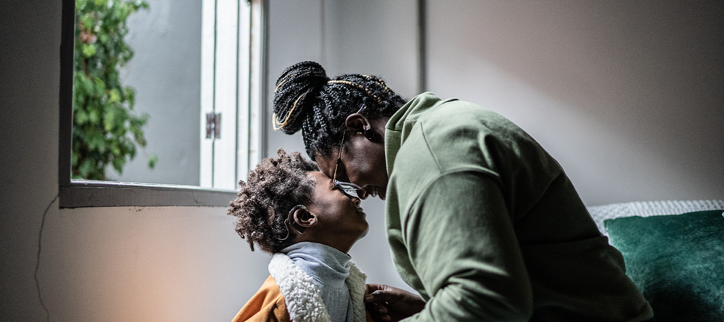 Mother and son at a window