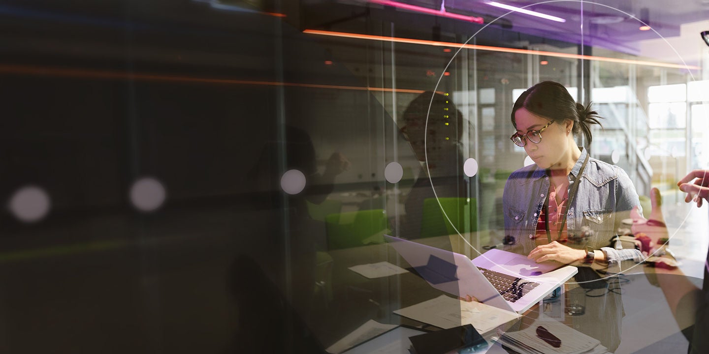 Woman and man posting sticky notes on window 