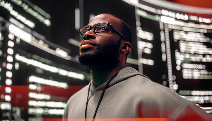 Man looking around with technology around him