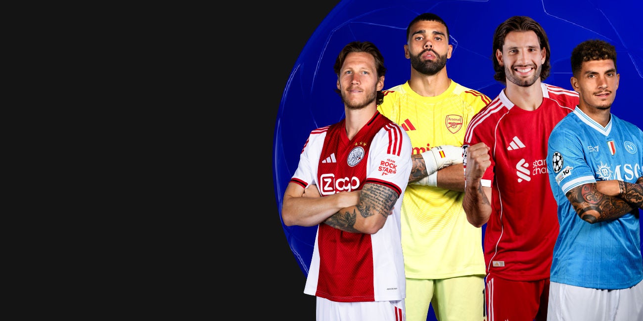 Two smiling people enjoying the benefits of being a Mastercard cardholder.