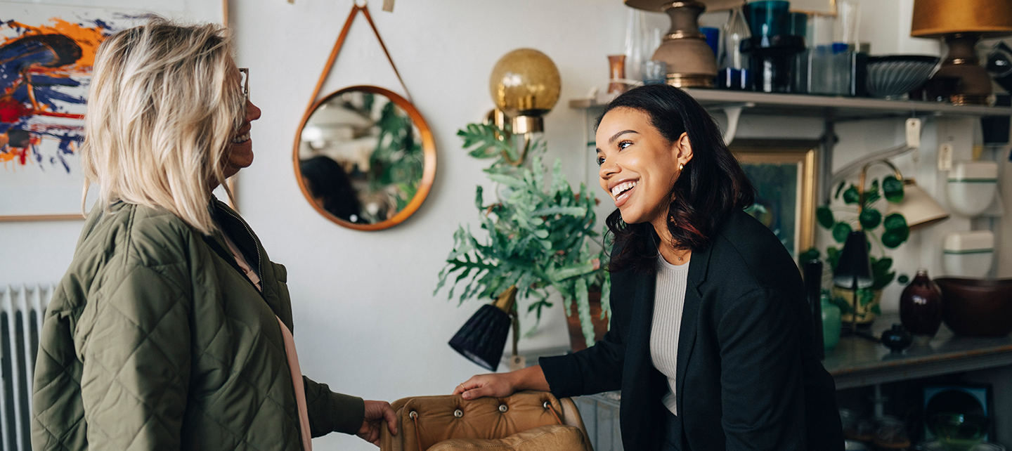 Woman sales associate selling to a customer mobile