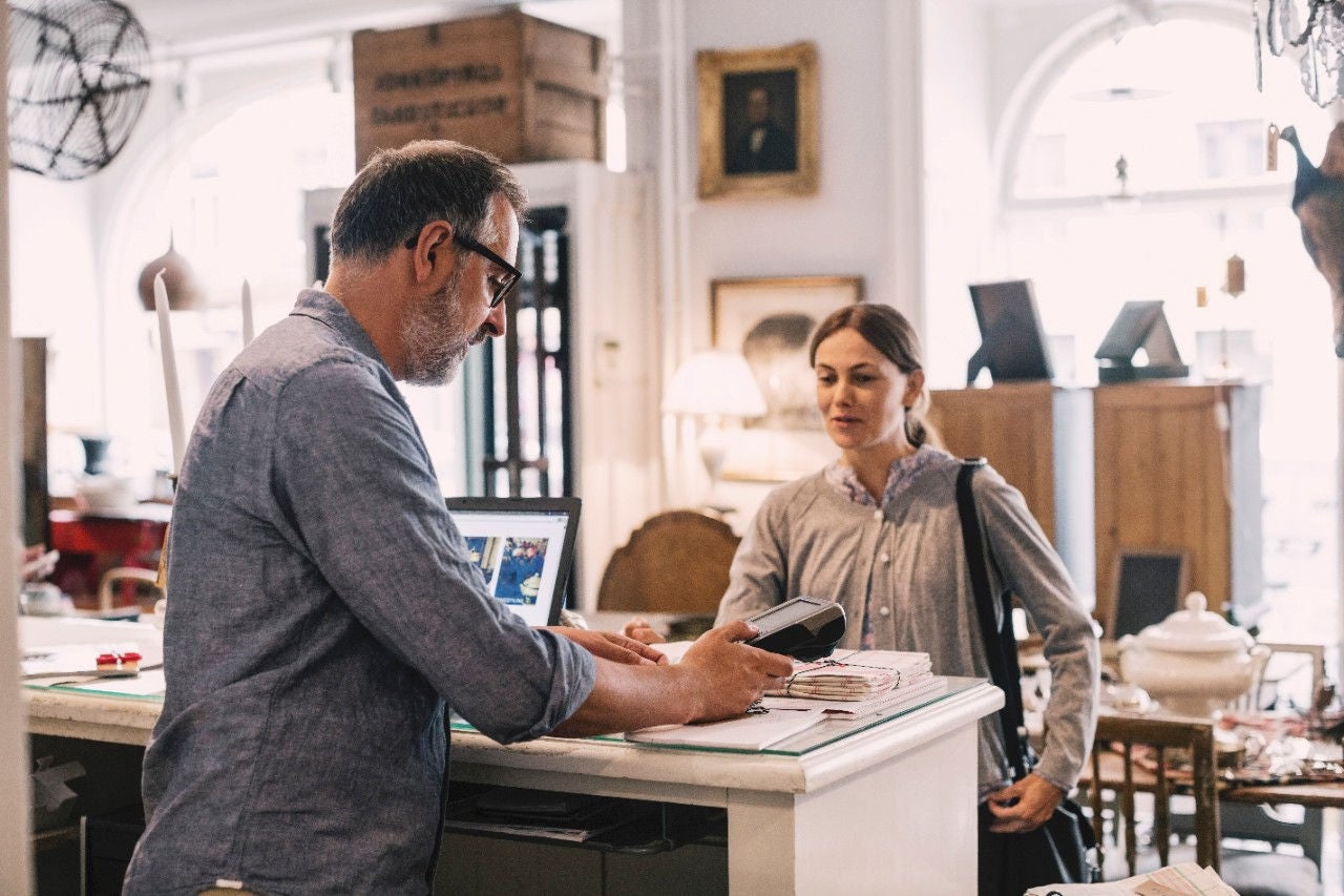 Man looking at his phone to view real-time identity insights.