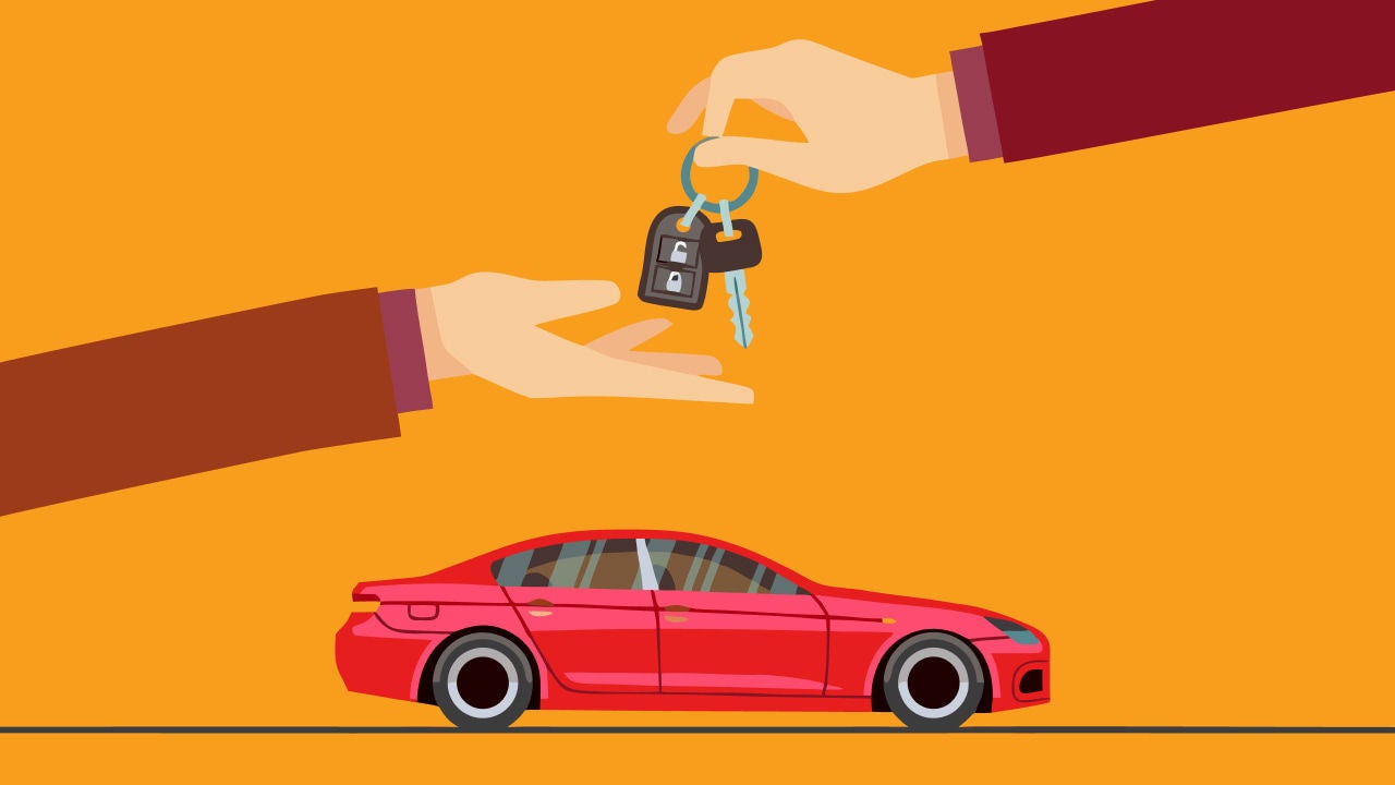 hand giving car keys over vehicle