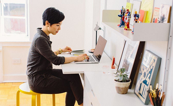 Woman using laptop at home