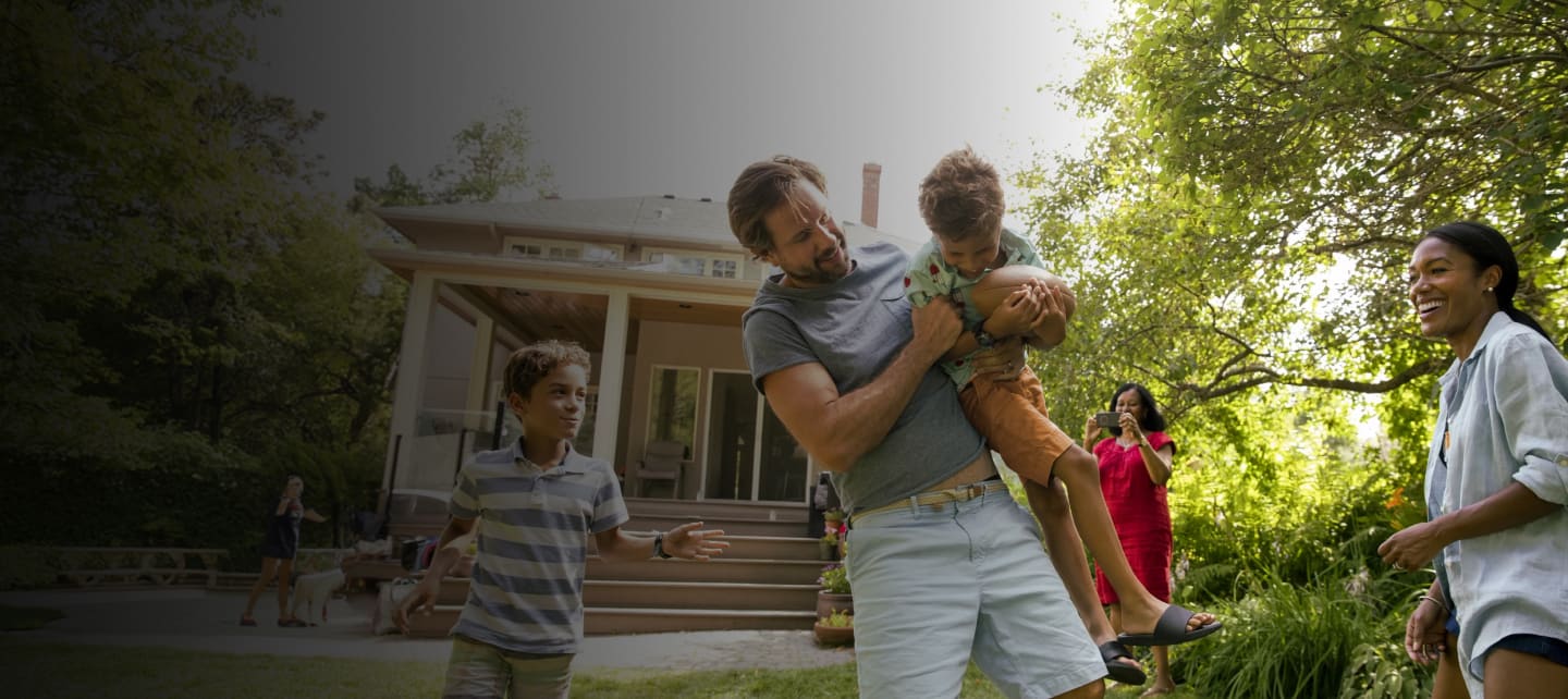 family playing football in a front yard