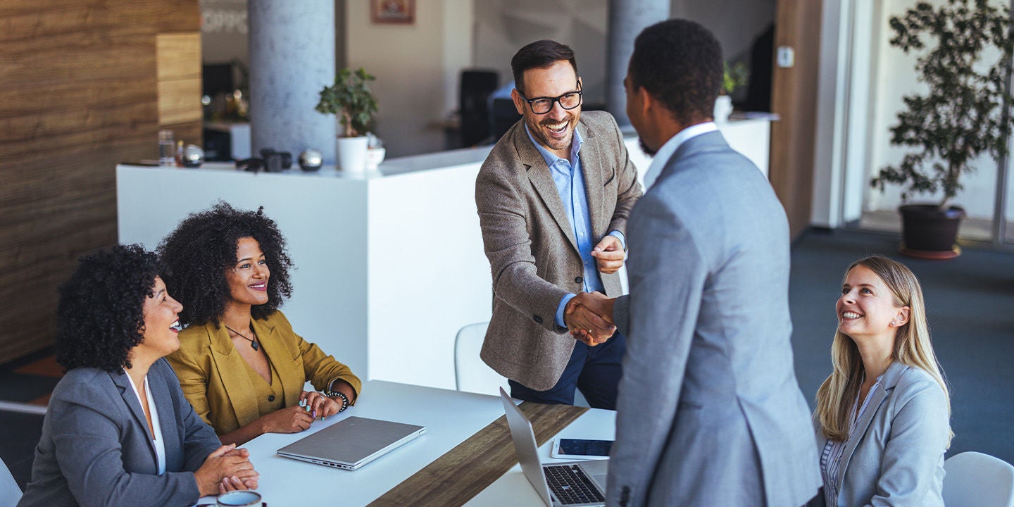 Employees shaking hands