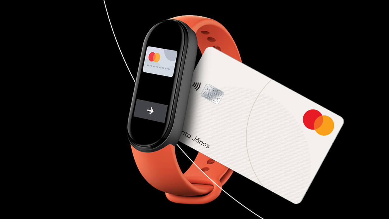 Xiaomi okoskarkötő érintéses fizetéshez Mastercard bankkártyával, fekete háttéren, modern termékmegjelenítéssel.