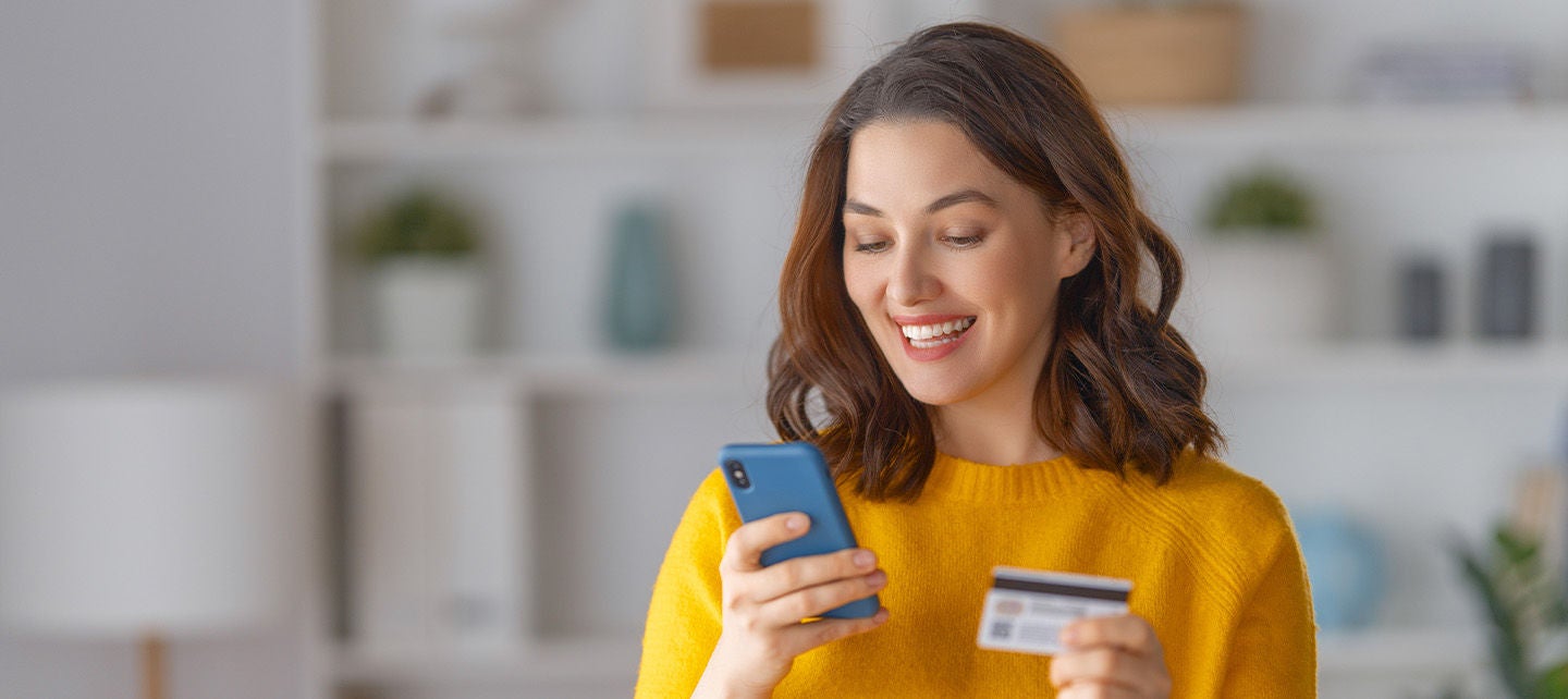 Woman making an online payment on her phone