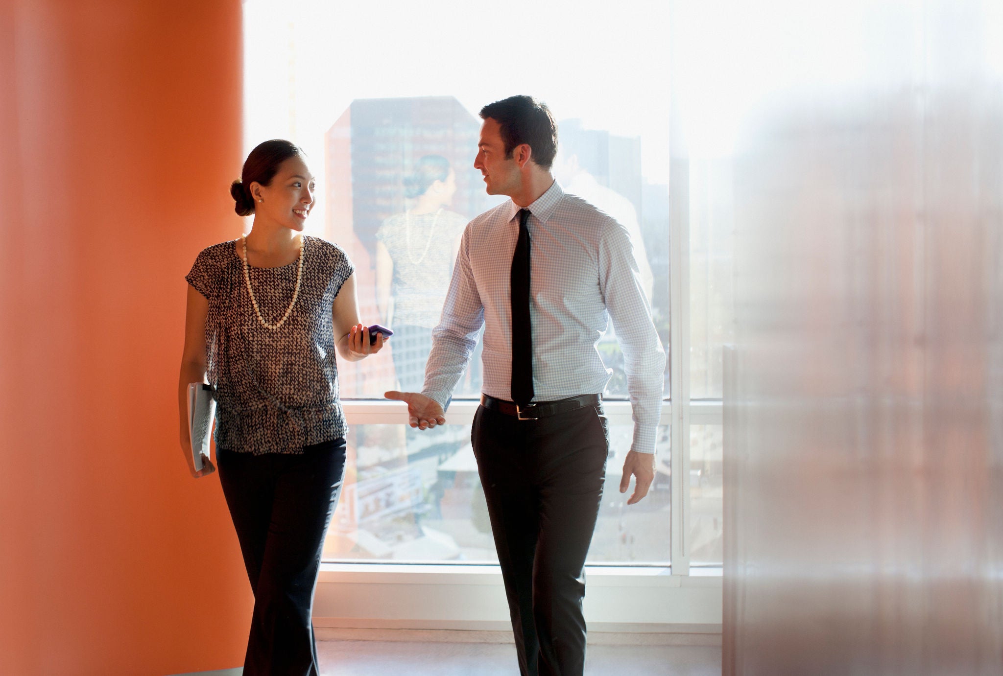 Two people walking and discussing Money Movement