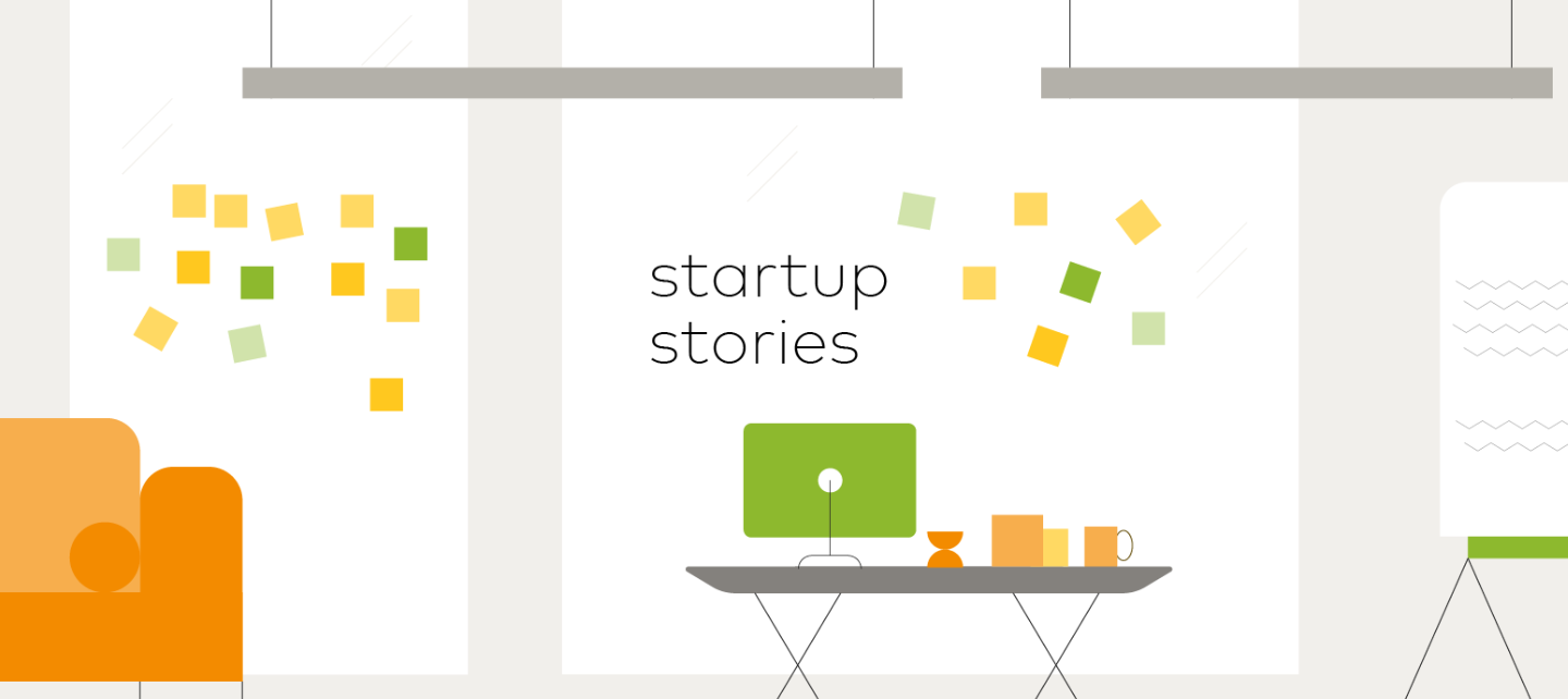 Startup Stories illustration of a couch and desk with computer and post-its on the wall