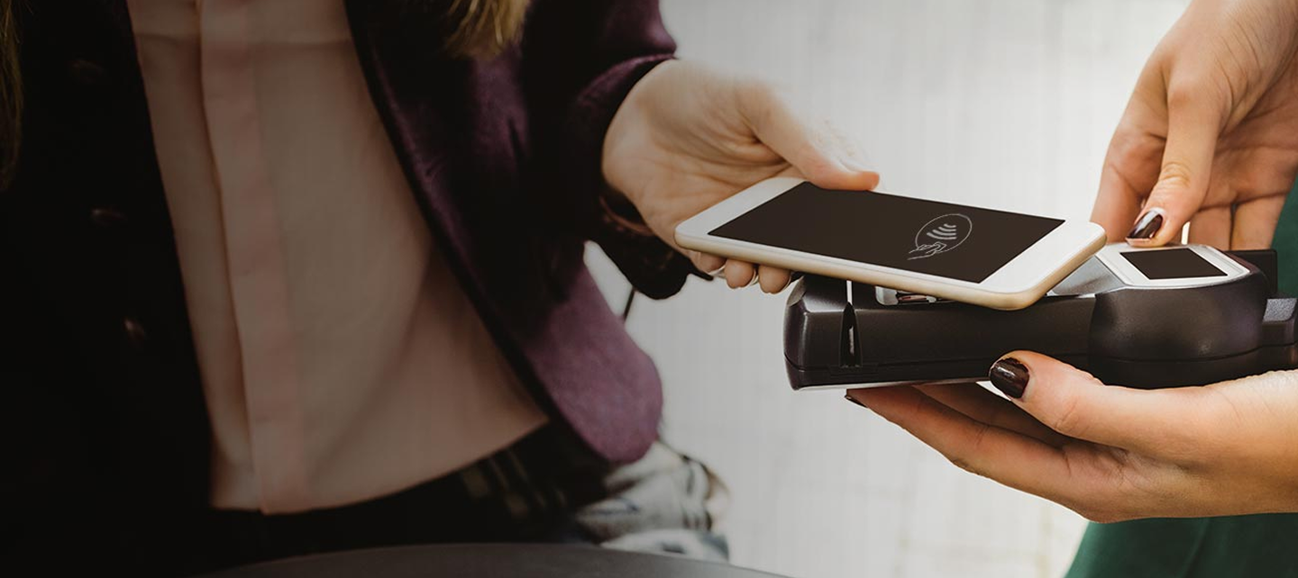 Woman paying using phone